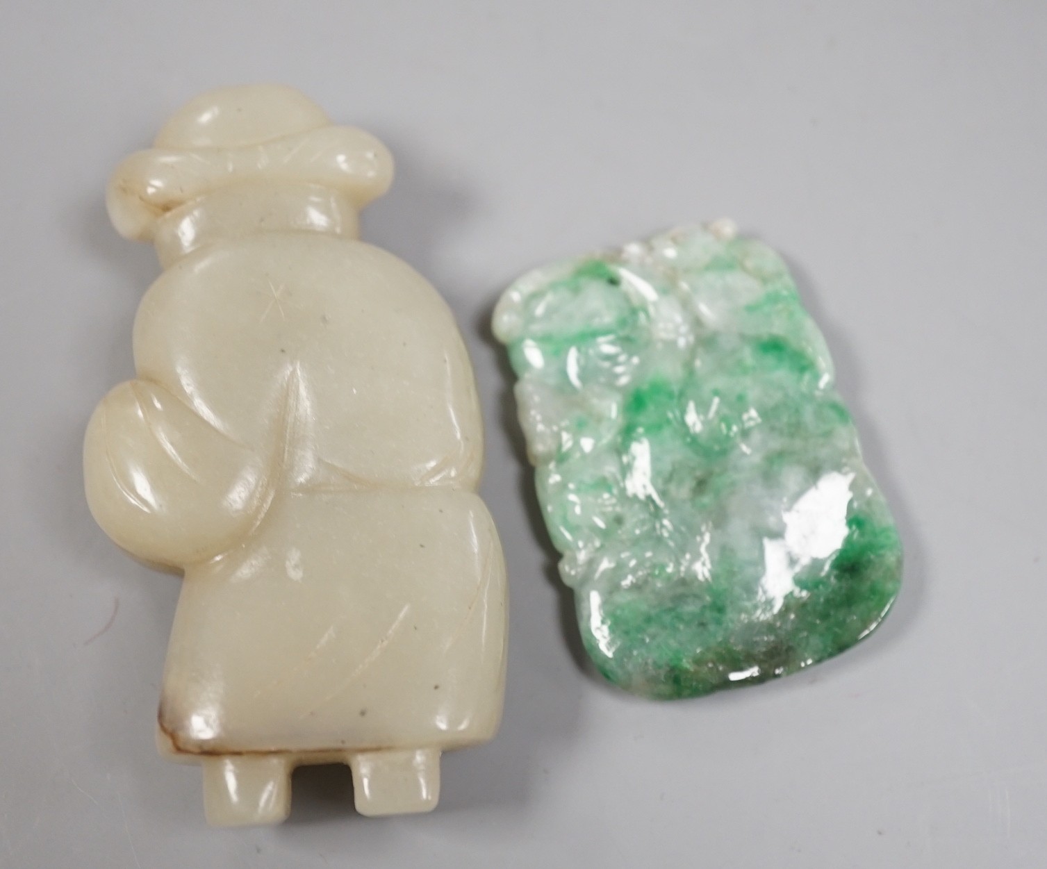 A Chinese celadon jade figure and a jadeite plaque (2)